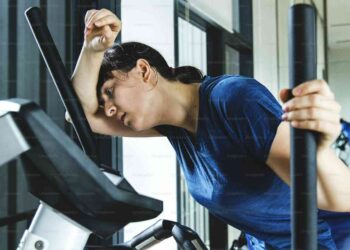 Woman resting on a threadmill