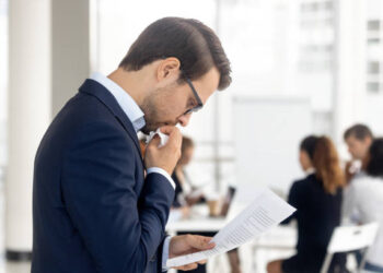 Anxious man preparing for a performance feeling afraid of public speaking.