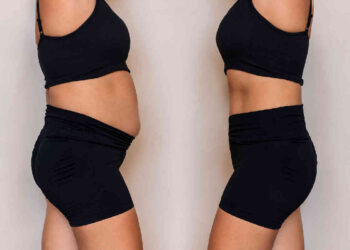 Image of two women, one with more belly fat and the other with flat abdomen