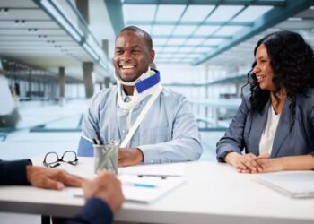 Pedestrian injury lawyer consulting with a client