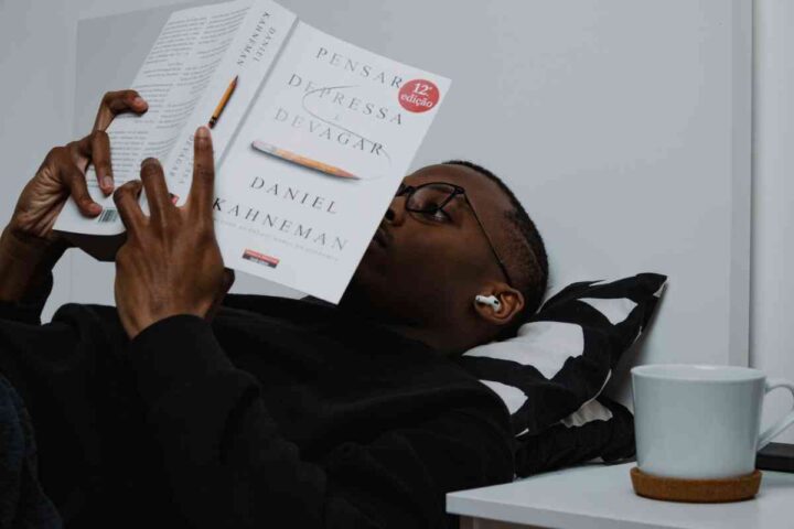 a black young man immersed in a book
