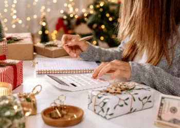 a woman making a holiday budget